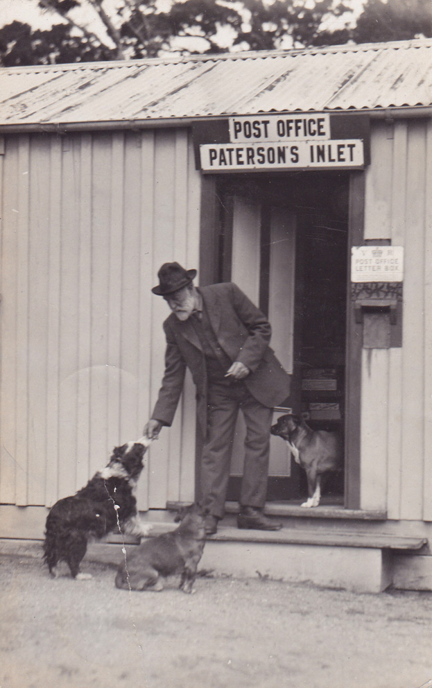 Gentleman with dogs at Paterson's Inlet Post Office. Photo courtesy of The Lothians