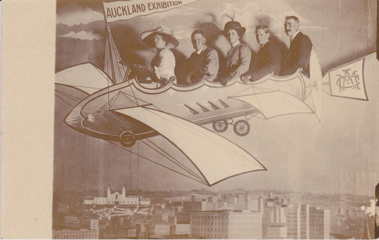 Auckland Exhibition attendees in a mock up flying machine Lemuel Lyes Collection
