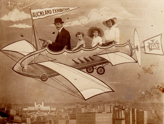 Auckland Exhibition visitors enjoy a ride in a mock up "flying machine" Courtesy of Timespanner