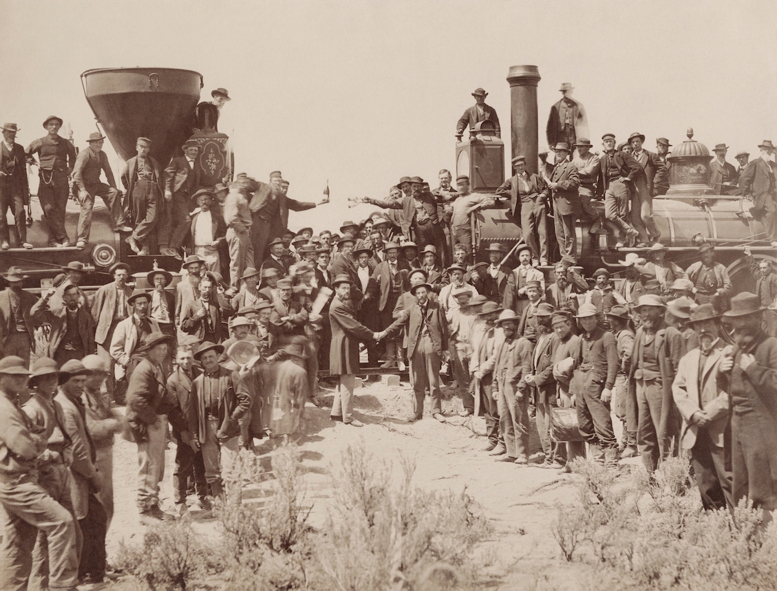 east_and_west_shaking_hands_at_the_laying_of_last_rail_union_pacific_railroad_-_restoration