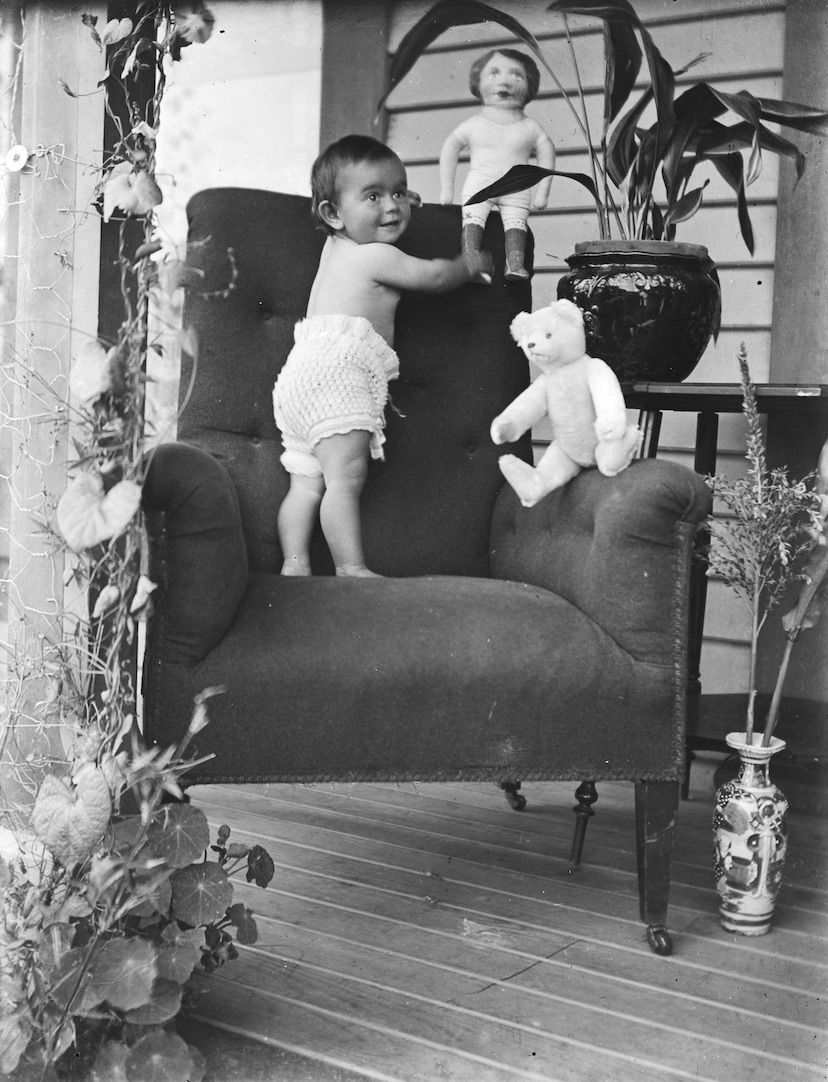 BabyStandingonChairwithToys copy